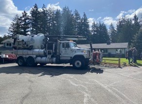 Washington Water truck parked in front of service line in residential area